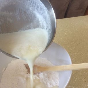 Pour the liquid into a bowl containing the flour.